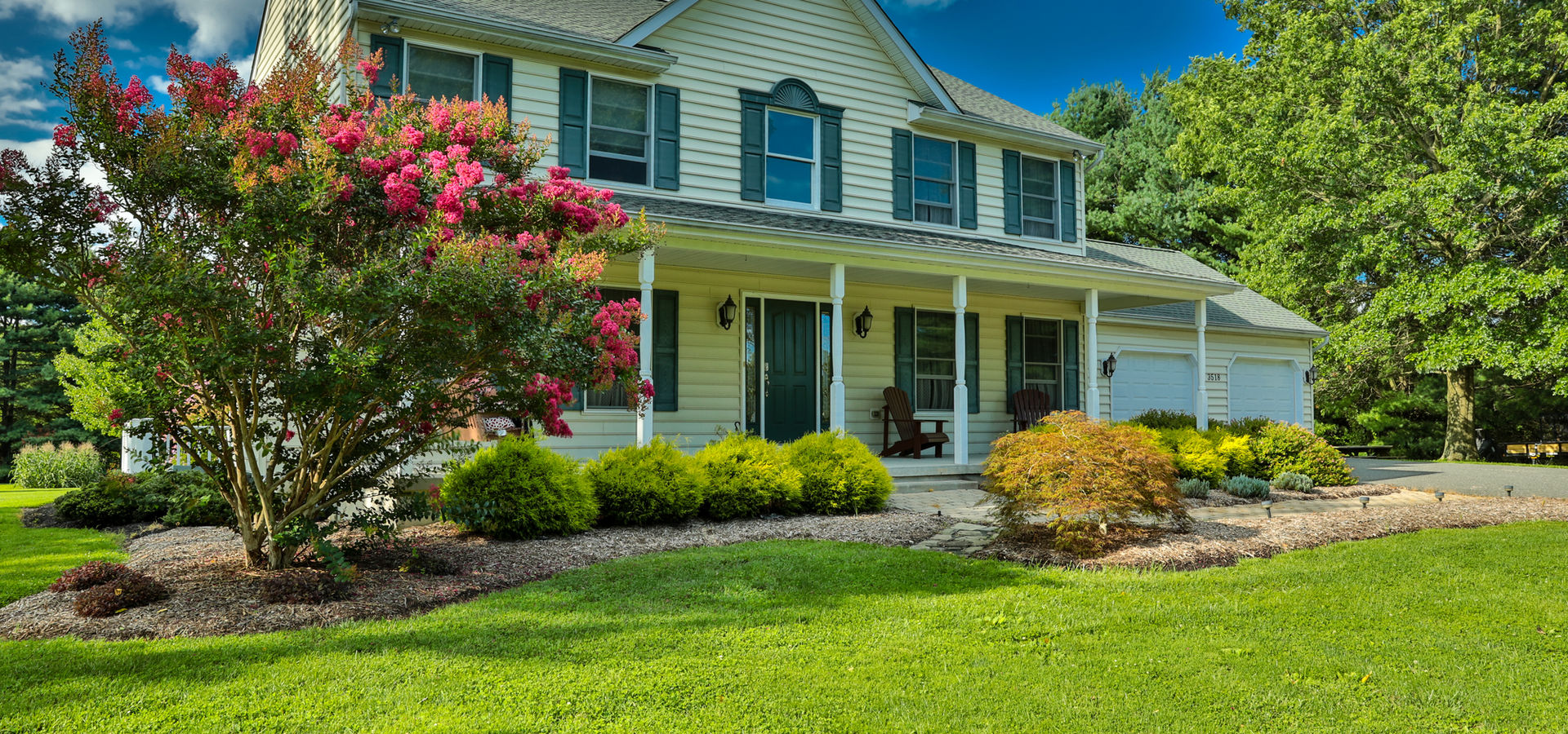 Expansive North Georgia mountain property with professional landscaping and rolling green hills