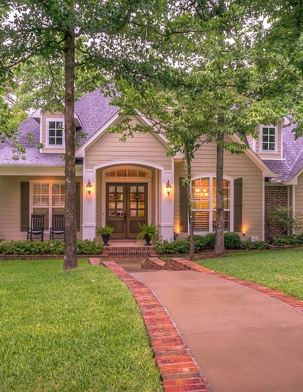 Dahlonega Landscaping crew maintaining a residential property with precision mowing and edging